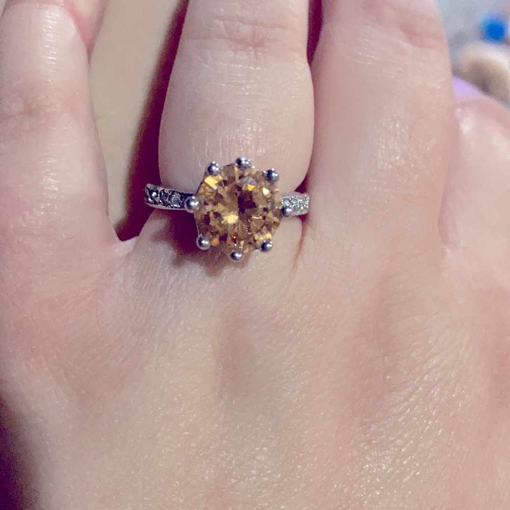 Orange stone ring, silver band.
